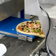pizza on conveyor belt